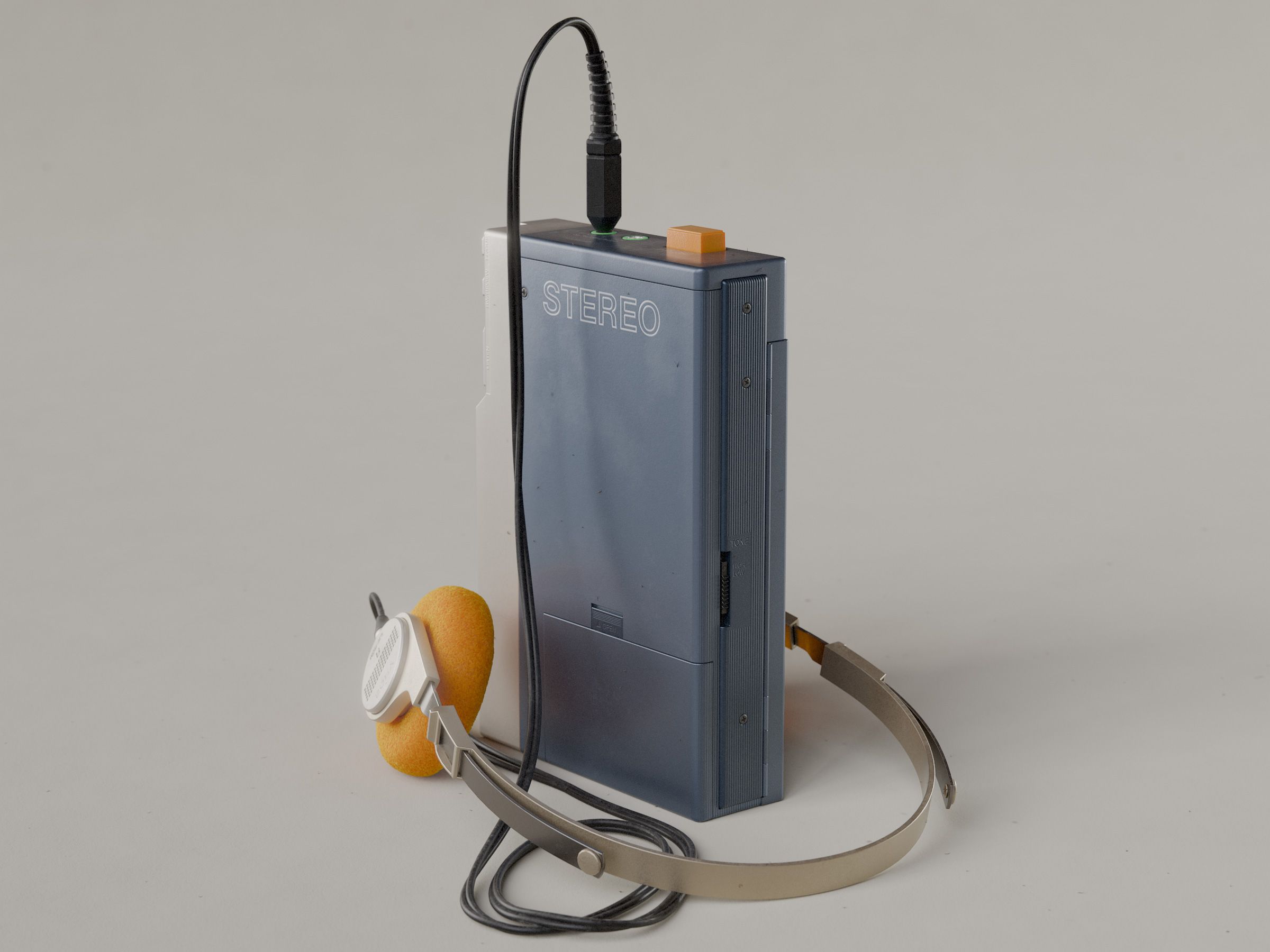 Walkman pictured from the back, with headphones, on white background.